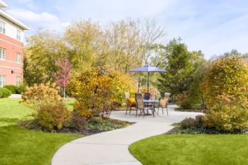 Walkway to garden with table and chairs